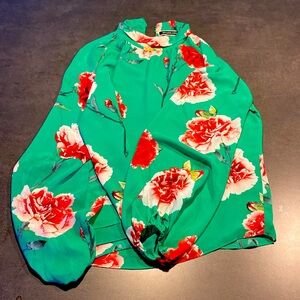 Melanie Lynn size twelve green dressy blouse with floral print